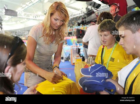 Former German swimming champion Franziska van Almsick signs autographs ...