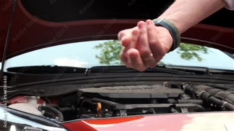 Vidéo Stock gesture fuck you hand under hood of red car concept of car