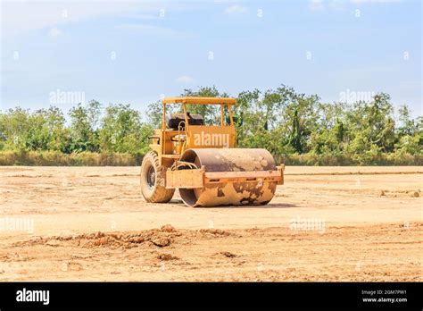 Soil Vibration Roller During Sand Compacting Works At Construction Site