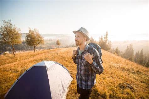 Handsome Bearded Man Tourist Exploring New Places On Top Of Mountains