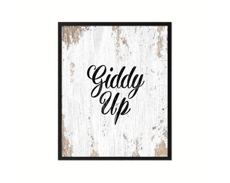 A White And Black Sign That Says Giddy Up