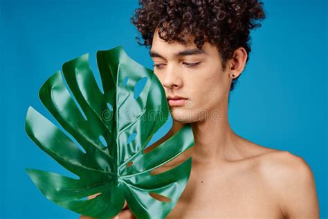 Handsome Man Naked Shoulders Green Leaf Clear Skin Blue Background