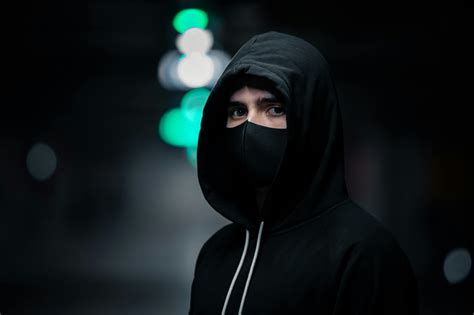 Person In Black Hoodie Wearing Black Mask · Free Stock Photo