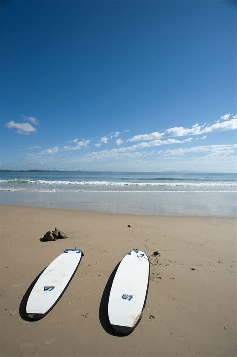 Free Image Of Two Surfboards On A Deserted Beach Freebie Photography