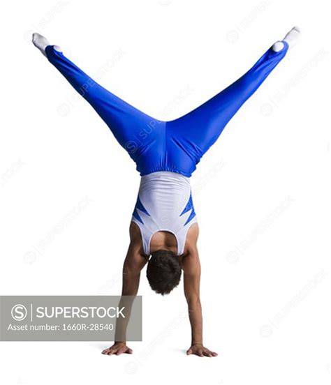 Male gymnast doing floor exercises - SuperStock