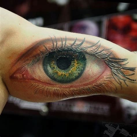 Awesome realistic green eye tattoo by Cris Gherman - Tattooimages.biz