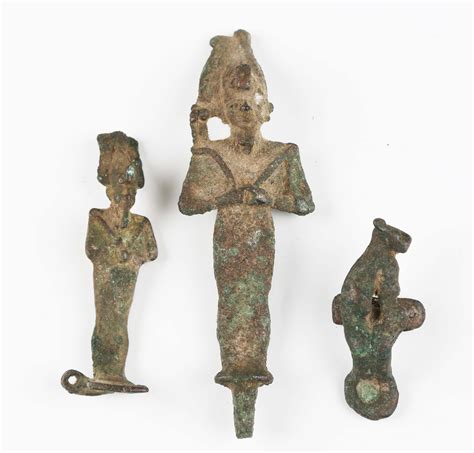 An Ancient Egyptian Bronze Figure Of Osiris Modelled Holding A Crook