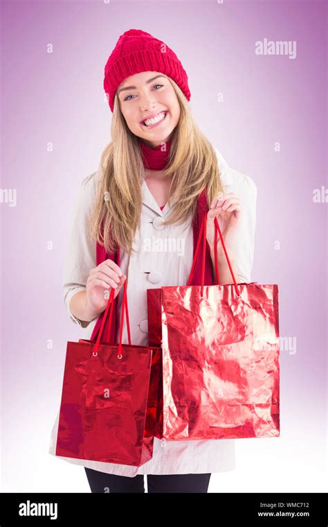 Pretty Blonde Holding Shopping Bags On Vignette Background Stock Photo