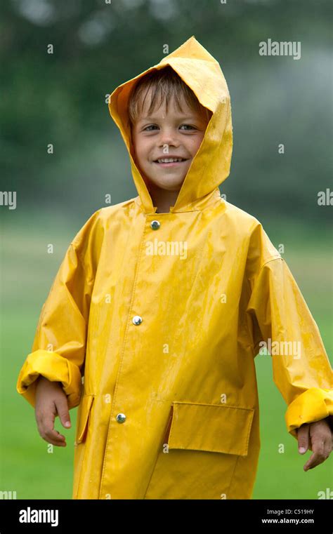 Portrait Of Young Boy Wearing Yellow Raincoat Stock Photo 37523527 Alamy