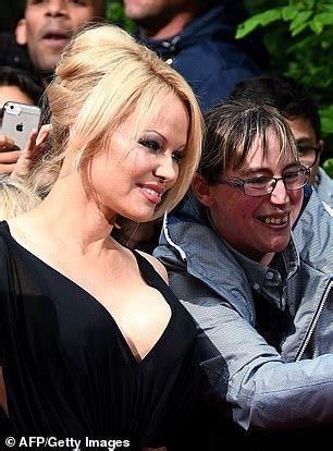 Pamela Anderson 51 Wears A Plunging Gown As She Makes A Rare