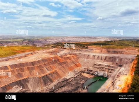 Aerial Industrial View Of Open Pit Deep Excavated Mine In Hunter Valley