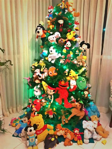 Christmas tree with plush toys as ornaments | Cartoon christmas tree ...