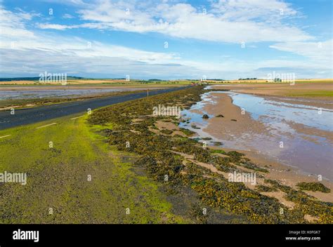 Causeway to Holy Island Stock Photo - Alamy