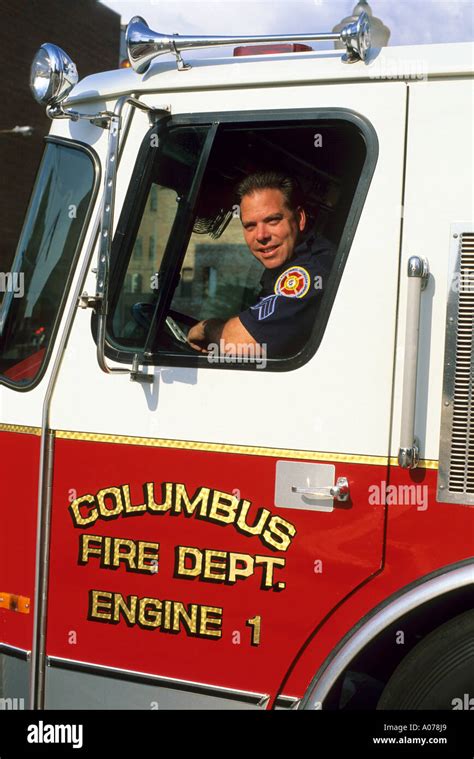 A Fireman In The Drivers Seat Of A Fire Truck In Columbus Georgia