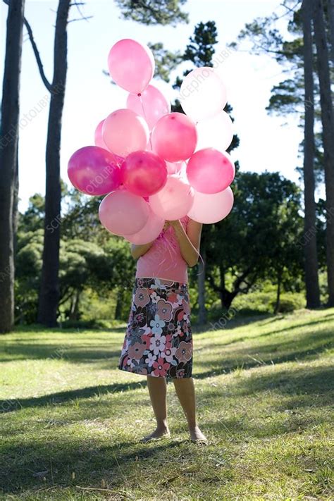 Woman Holding Balloons Stock Image F001 2668 Science Photo Library