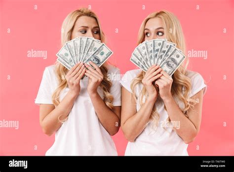 Mystery Blonde Twins Wearing In T Shirts Covering Her Faces And Looking