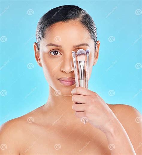 Creative Makeup And Portrait Of Girl With Brushes In Hand To Apply