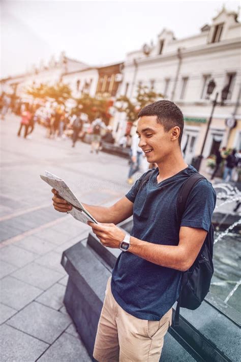 Smiling Man Exploring Map On City Street Stock Image Image Of Summer