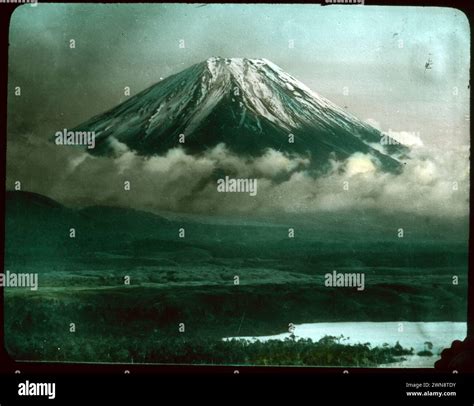 Snow Capped Mount Fuji Peaking Above The Clouds From Hebert Geddes