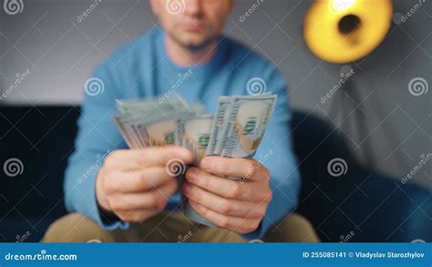 Man Counting US Dollar Bills Or Paying In Cash Concept Of Investment