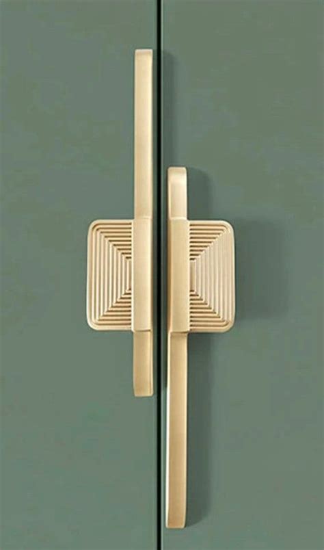 A Close Up Of A Door Handle On A Green Cabinet