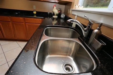 Black Granite With A Stainless Steel Sink Black Granite Countertops