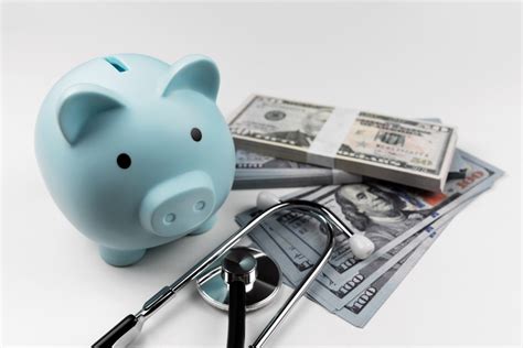 Piggy Bank And American Dollar With Stethoscope