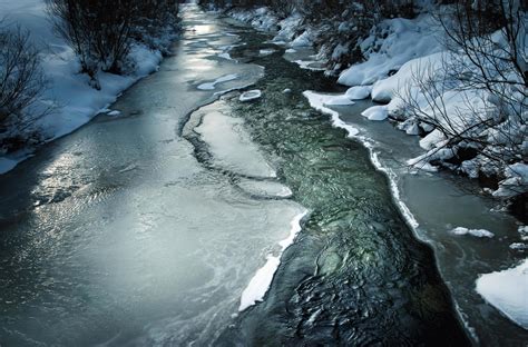 Dark winter scene with a frozen river 2177614 Stock Photo at Vecteezy