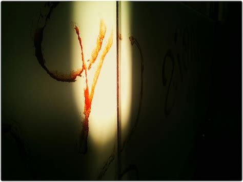 Premium Photo | Close-up of graffiti on wall with blood