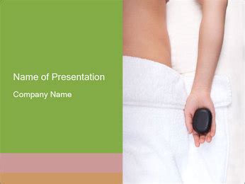 Woman Enjoying Hot Stone Therapy In A Tranquil Spa Setting Powerpoint Template Backgrounds