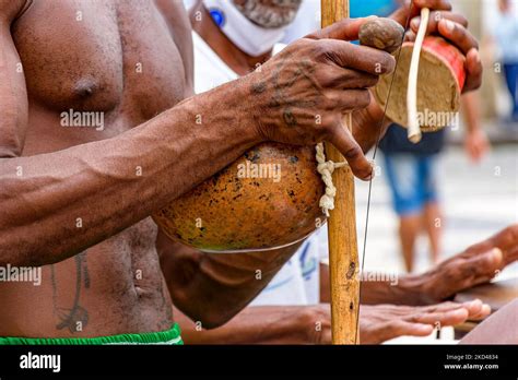 African American Musician Playing A Traditional Brazilian Percussion