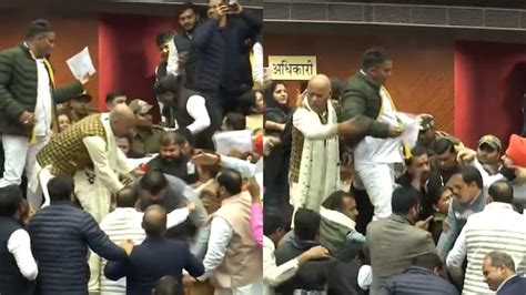 Delhi Mcd Ruckus Aap Bjp Members On Tables Beat Each Other Watch