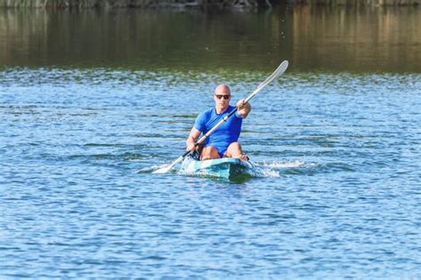 Premium Photo Young Man Kayaking On Lake Lake Kayaking