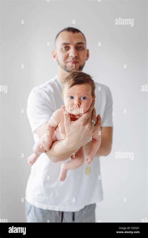 Young Caucasian Bearded Father Holding Carrying Newborn Baby Male Man