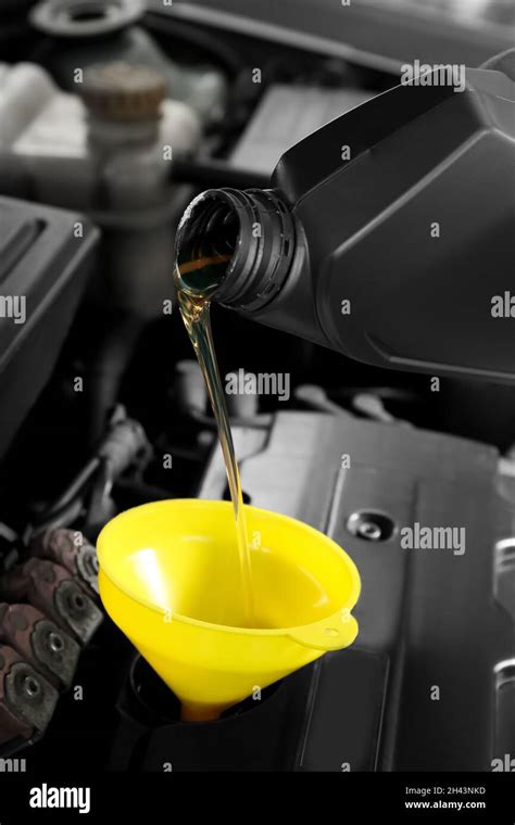 Pouring Motor Oil From Canister Into Car Engine Stock Photo Alamy