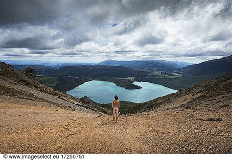 New Zealand New Zealand Tasman Rear View Of Naked Man Looking At Lake