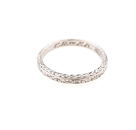 Lot - ENGRAVED PLATINUM WEDDING BAND