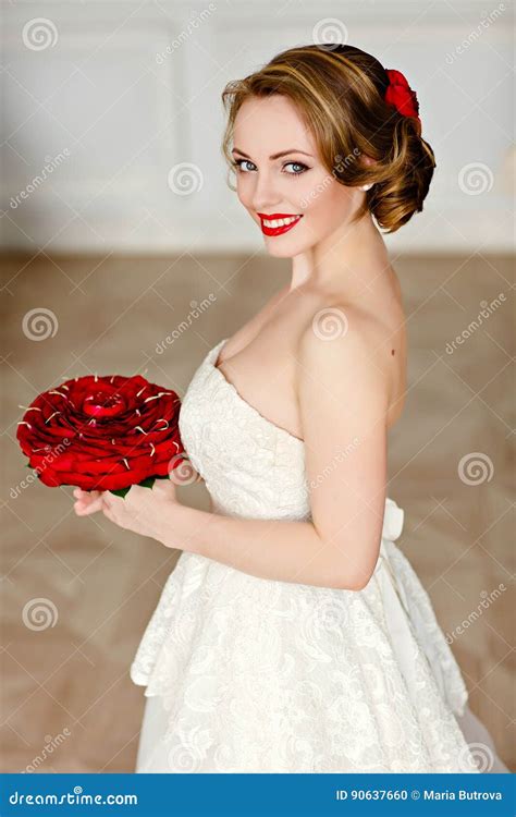 Charming Blonde Girl With Beautiful Smile In A White Lace Dress Stock