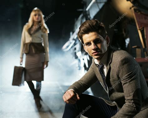 Handsome Guy And The Blonde Woman In The Background Stock Photo By