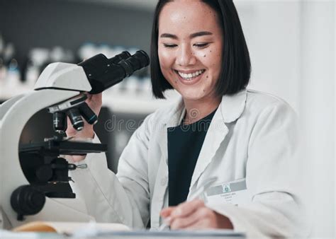 Microscope Asian Woman And In Laboratory For Research Innovation And