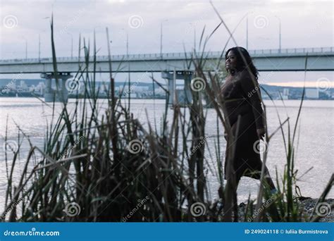 Curly Black Haired Smiling Plump Afro American Multiracial Woman