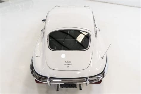 The Back End Of An Old White Car