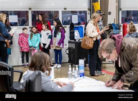 Republican Gubernatorial Candidate Tudor Dixon Waits In Line To Vote With Her Four Daughters At