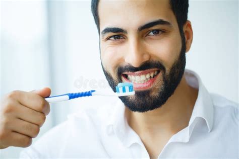 Beautiful Woman With A Great Smile Holding Toothbrush Stock Image