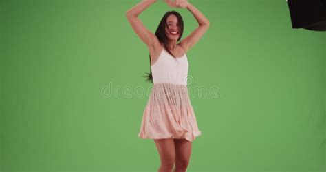 A Millennial Latina Girl Texts Her Friends On Green Screen Stock
