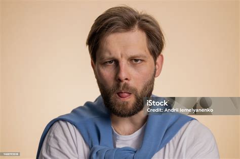 Cheerful Funny Bully Caucasian Man Showing Tongue Making Silly Faces