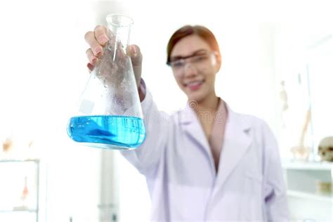 Hand Of Beautiful Asian Female Scientist Wear Lab Coats And Safety Glasses Happy Smiling