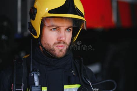 Photo Of Fireman With Gas Mask And Helmet Near Fire Engine Stock Photo