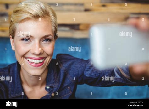 Smiling Pretty Blonde Talking A Selfie Stock Photo Alamy