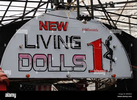 New Living Dolls Signboard Close Up Shot Of A Night Club Bar At